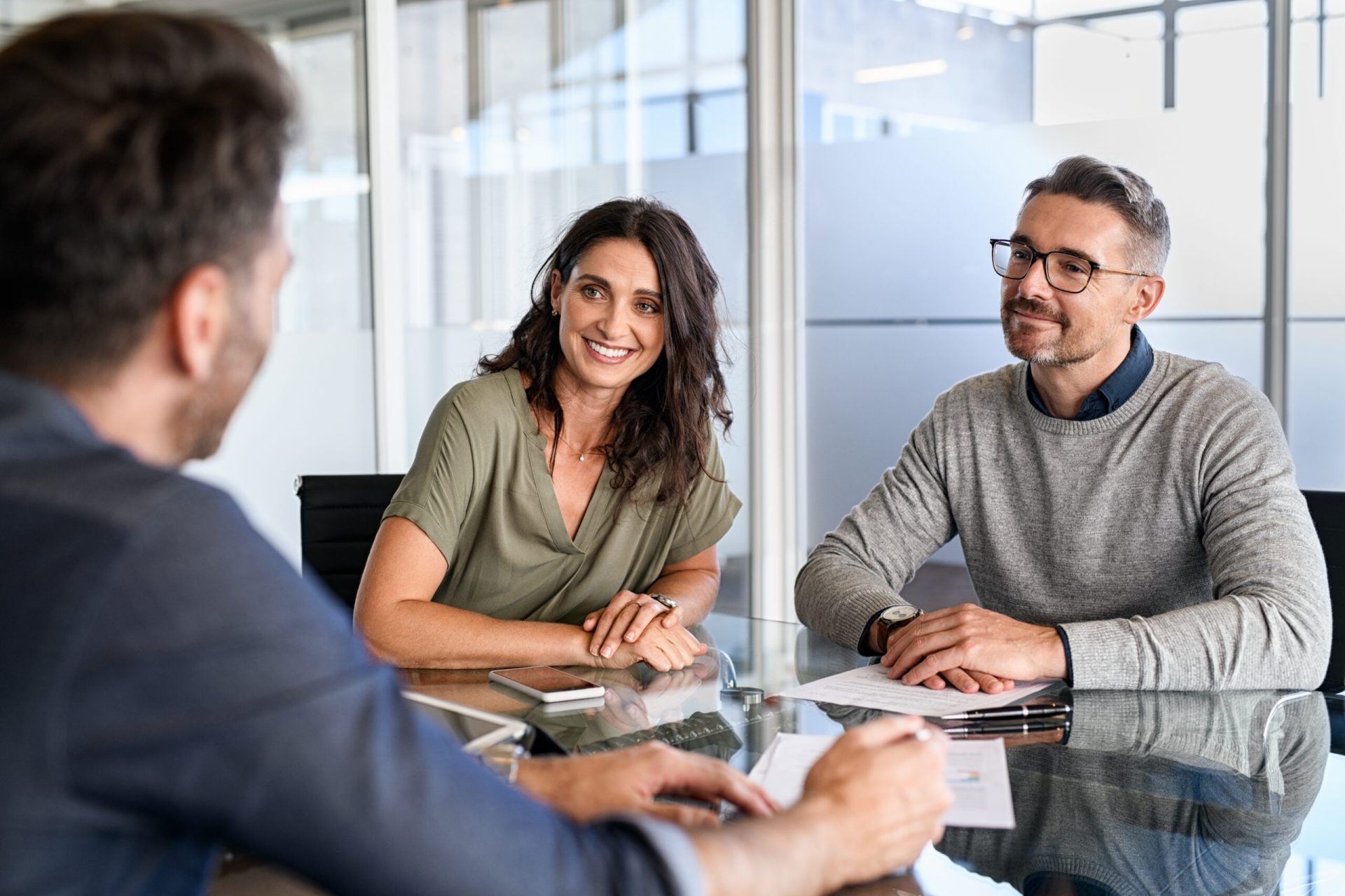 Clients listening to their broker describe Funding's loan solutions