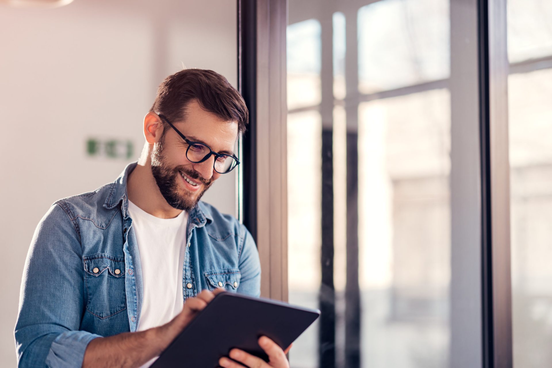 Business man exploring Funding's business loan solutions on tablet device